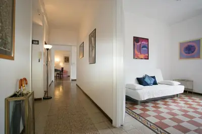 a hallway with a white couch in a room at Morin 27 in Rome