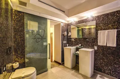 a bathroom with a toilet and a shower and a sink at Trevi Collection Hotel - Gruppo Trevi Hotels in Rome