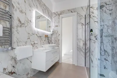 a purple bathroom with a shower and a sink at St. Peter Grand Suite in Rome