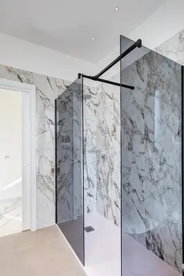a white bedroom with a bed and a window at St. Peter Grand Suite in Rome