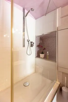 a bathroom with a shower with a tub at Colosseum romantic loft in Rome