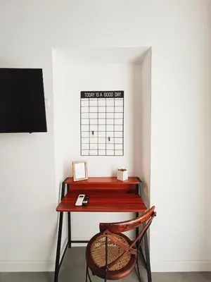 a desk with a chair next to a wall at La tua casa a Piazza del Popolo in Rome