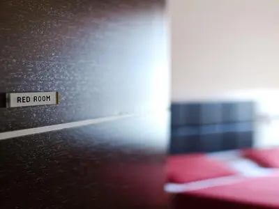 a red room with a red room sign on a wall at Cenci Bed & Breakfast Fontana di Trevi in Rome