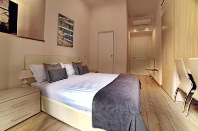 a bedroom with a large bed in a room at Coladir Guest House in Rome