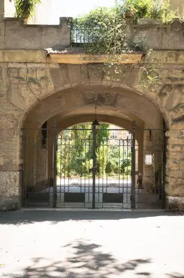 an entrance to a stone building with an iron gate at Casa vacanze 
