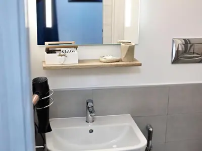 a bathroom with a sink and a mirror at Relais Villa Borghese in Rome