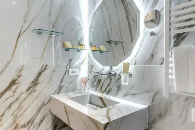 a bathroom with a sink toilet and a mirror at Rome55 - Piazza di Spagna in Rome