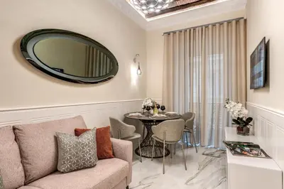 a bedroom with a bed and a coffered ceiling at Rome55 - Piazza di Spagna in Rome