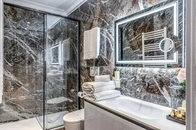 a bedroom with a bed and a desk and a couch at Rome55 - Piazza di Spagna in Rome