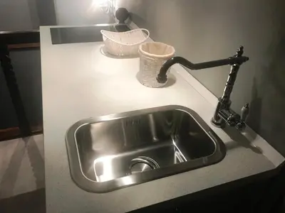 a kitchen counter with a sink and a faucet at Di Rienzo Residences in Rome