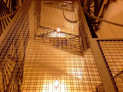 a room filled with gold metal scaffolding at Soggiorno Angelus in Rome