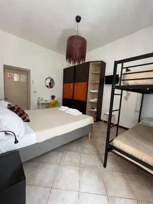 a bedroom with a bed and a bunk bed at Domus Amica in Rome