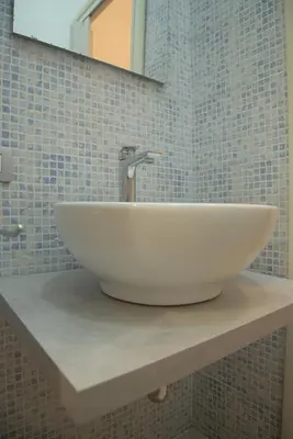 a white sink on a counter in a bathroom at Domus Amica in Rome