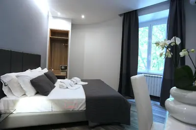 a bedroom with a bed with towels on it at B&B Home 77 in Rome
