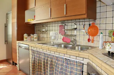 a kitchen with a sink and a counter top at A Casa Di Magda (Al centro di Roma) in Rome