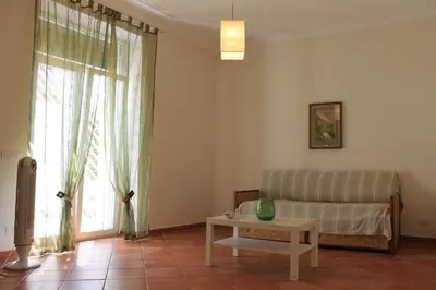 a living room with a couch and a table at A Casa Di Magda (Al centro di Roma) in Rome