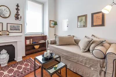 a living room with a couch and a fireplace at Sora Menica in Rome