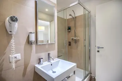 a bathroom with a sink and a shower at A Peace Of Rome B&B in Rome