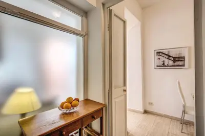 a room with a bowl of fruit on a table at GuestHouse o Affittacamere Casa Fienaroli 2 in Rome
