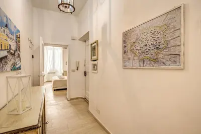 a hallway with a large painting on the wall at GuestHouse o Affittacamere Casa Fienaroli 2 in Rome