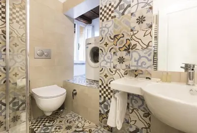 a bathroom with a toilet and a sink at Cozy apartment in via degli Spagnoli - FromHometoRome in Rome