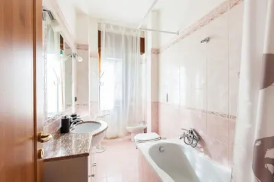 a bathroom with a tub and a toilet and a sink at Vatican's Sight in Rome