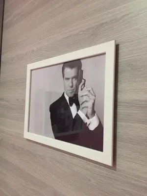 a picture of a man talking on a cell phone at Oscar 2 in Rome
