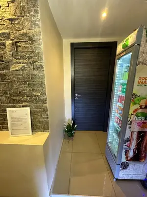 a door to a vending machine in a building at Candia Rooms in Rome