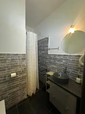 a bathroom with a sink and a mirror at Candia Rooms in Rome