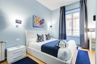 a bedroom with a bed and a window at Easy Budget Colosseo in Rome