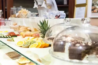 a buffet with fruits and vegetables on a table at Suite Dal Conte in Rome