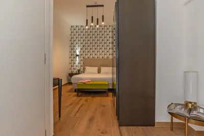 a bedroom with a bed in a room at Navona Essence Hotel in Rome