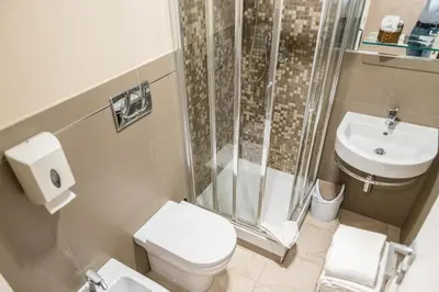 a bathroom with a shower and a toilet and a sink at Aelius in Rome