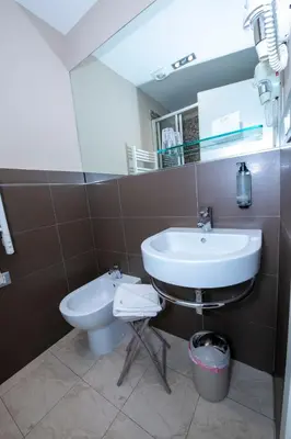 a bathroom with a sink and a toilet at Aelius in Rome