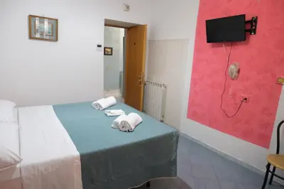 a room with a phone on a table and a chair at Andromeda by Gialel in Rome