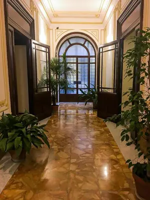 a hallway with potted plants in a building at Andromeda by Gialel in Rome