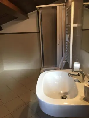 a bathroom with a white sink in a room at BB Il Re Alla Reginella Guest House in Rome