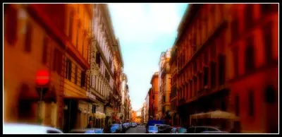 a blurry picture of a city street with buildings at Rhome Sweet Rhome in Rome
