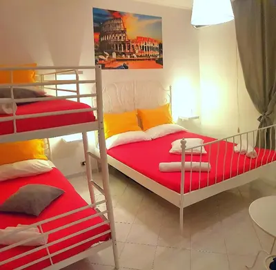 a bedroom with two bunk beds with red and yellow at Rhome Sweet Rhome in Rome