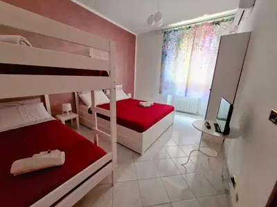 a bedroom with two bunk beds and a television at Rhome Sweet Rhome in Rome