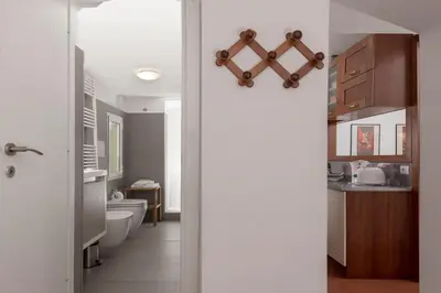 a bathroom with a toilet and a sink at Opera House in Rome