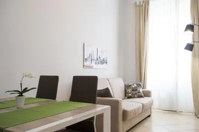 a living room with a couch and a table at Enjoy Ponte Lungo in Rome