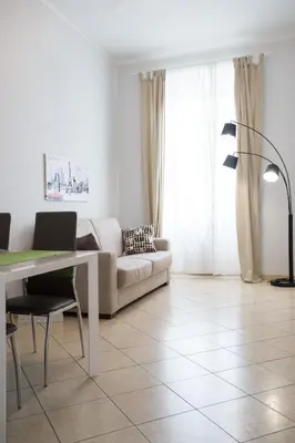 a living room with a couch and a table at Enjoy Ponte Lungo in Rome