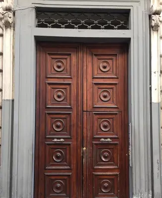 a large wooden door in a building at Affittacamere Alex in Rome