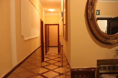 a hallway with a mirror and a hallway with a tile floor at Affittacamere Alex in Rome
