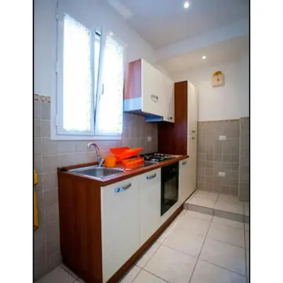 a small kitchen with a sink and a window at Domus Ines Roma San pietro in Rome