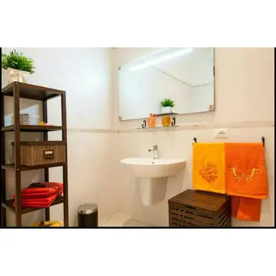a bathroom with a sink and a mirror at Domus Ines Roma San pietro in Rome