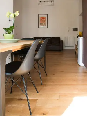 a living room with a table and chairs at Domus Claudi Colosseum in Rome