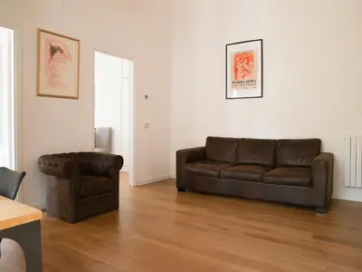 a living room with a couch and a chair at Domus Claudi Colosseum in Rome