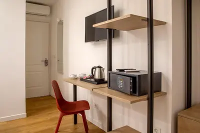 a hotel room with two beds and a piano at Hotel Ciao in Rome